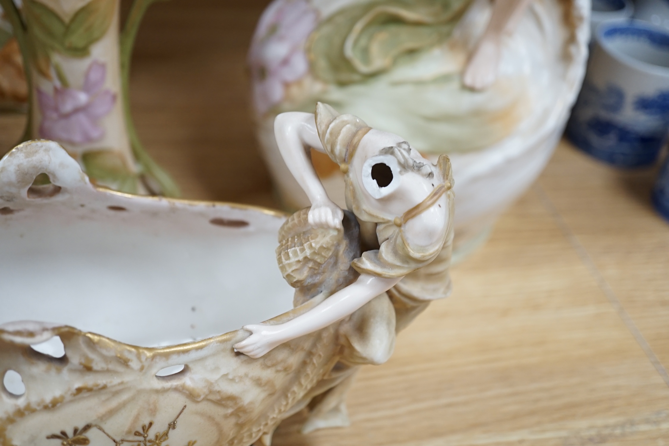 Five Royal Dux vases, including a pair of spill vases and a German porcelain boat shaped vase, largest 48cm high. Condition - four good, boat shaped vase poor